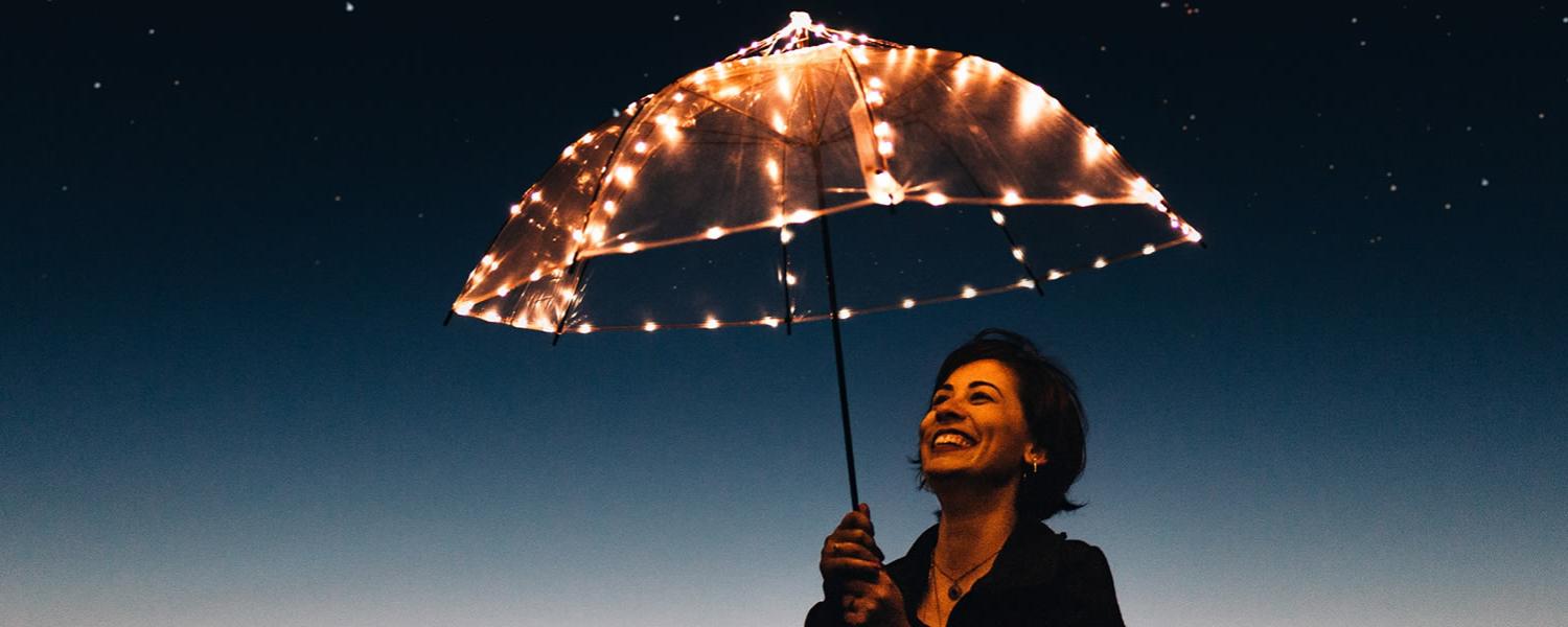 Woman with lighted umbrella