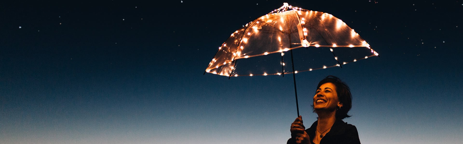 Woman with lighted umbrella